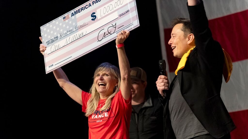 Musk with giant check