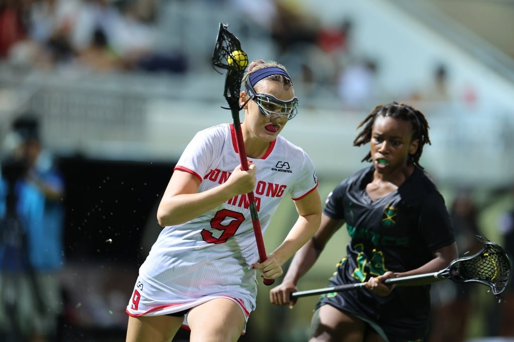 Hong Kong’s Aurora Bolitho (left) and Jamaica’s Christina Stewart in action during the World Lacrosse Women’s U20 Championship at Mong Kok Stadium. Photo: Dickson Lee