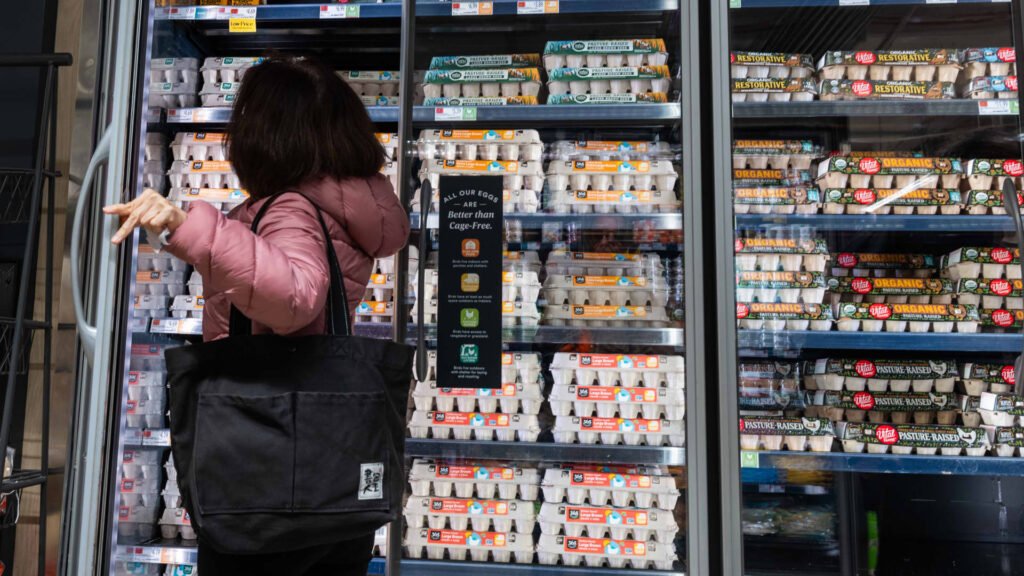 A person shops for eggs at a Whole Foods Market grocery store on December 17, 2024 in New York City. 