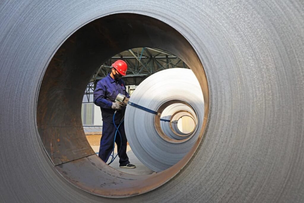 A worker on the strip production line in a factory in Luannan, Hebei province, China. (Image: YongXin Zhang / Alamy)