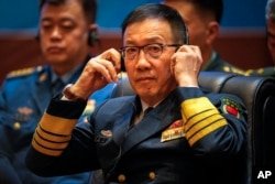 FILE - Chinese Defense Minister Dong Jun listens during the ASEAN-China defense ministers' meeting in Vientiane, Laos, on Nov. 20, 2024.