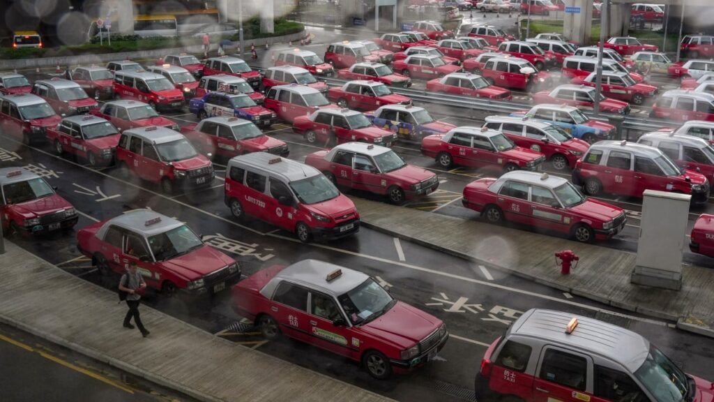 Hong Kong taxi union threatens 5-day strike if city fails to clamp down on Uber