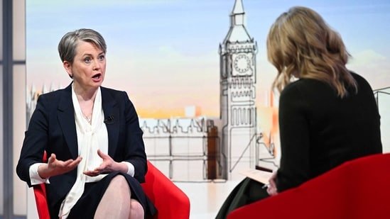 Britain's Home Secretary Yvette Cooper appearing on the BBC's "Sunday Morning" political television show with journalist Laura Kuenssberg.(AFP PHOTO / JEFF OVERS-BBC)