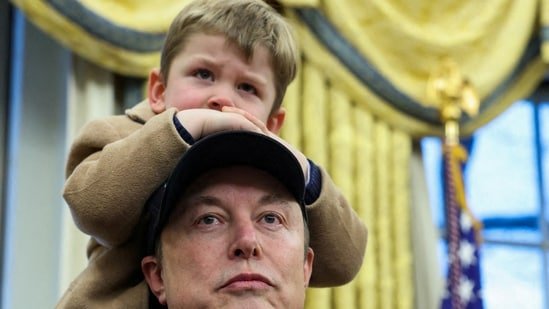 Elon Musk carries his son X AE A-XII on his shoulders in the Oval Office(REUTERS)