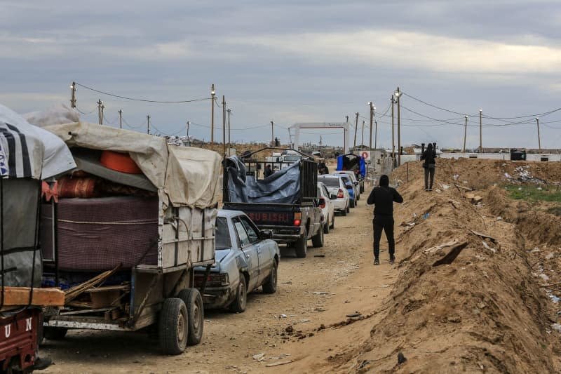 Palestinians cross back to their homes after the Israeli army withdrew from the Netzarim corridor, as part of the ceasefire agreement with Hamas. The corridor was created to separate the Gaza strip into northern and southern areas. Abed Rahim Khatib/dpa