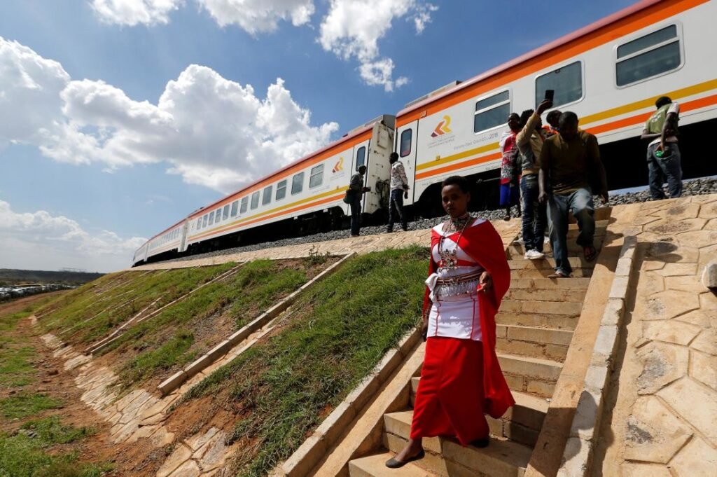 In this 2019 photo, people disembark from a train on the Standard Gauge Railway (SGR) line constructed by the China Road and Bridge Corporation (CRBC) and financed by Chinese government in Kimuka, Kenya.