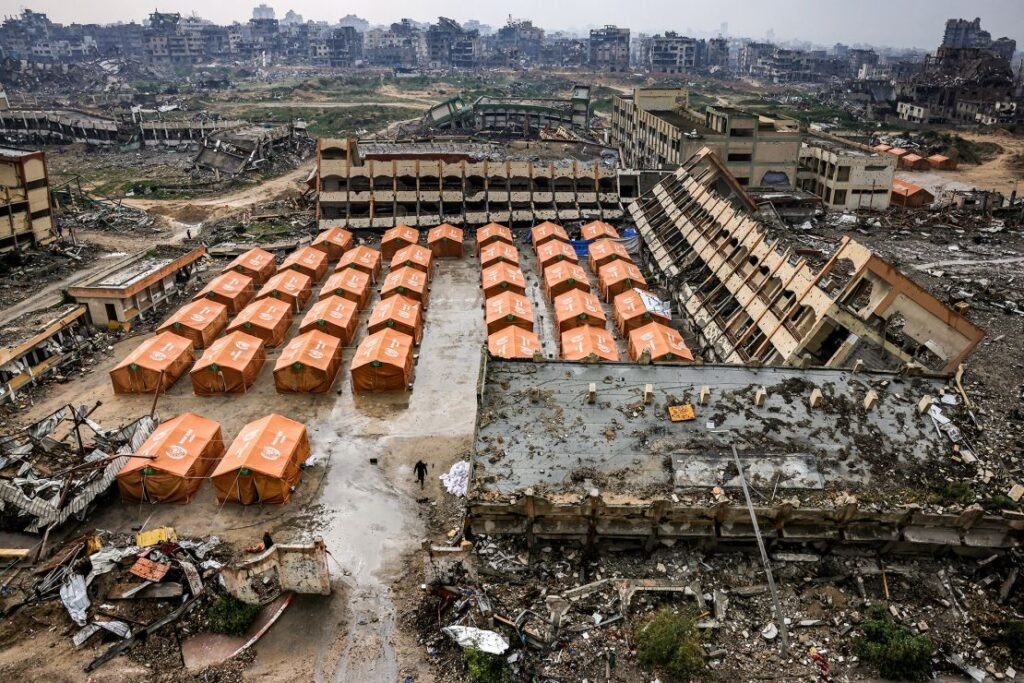 Tents sheltering displaced Palestinians are erected in the yard of a secondary school in the north of Gaza City on February 10, 2025, amid the current ceasefire deal.