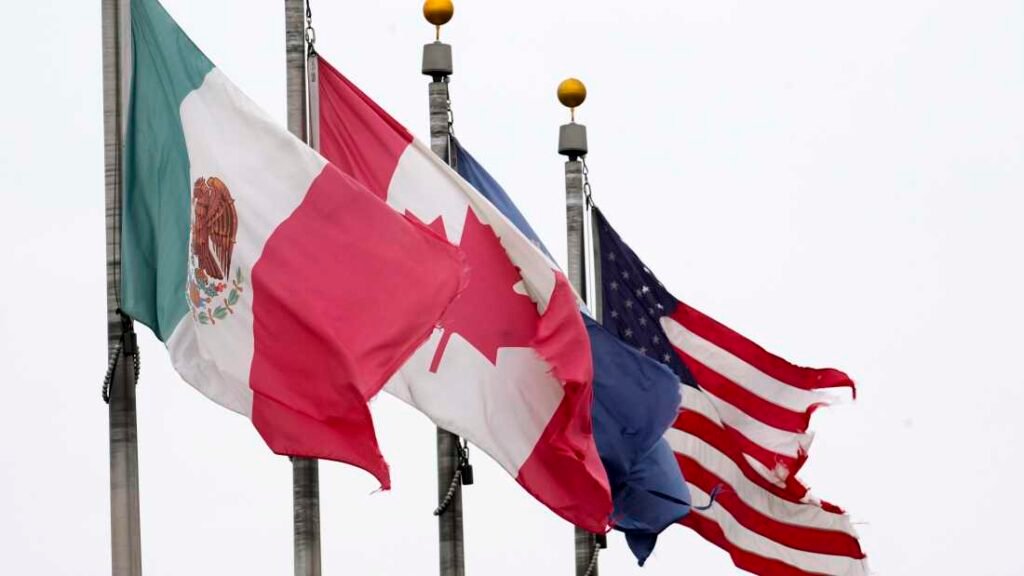 The flags of Mexico, Canada and the United States are shown near the Ambassador Bridge, Monday, Feb. 3, 2025, in Detroit.