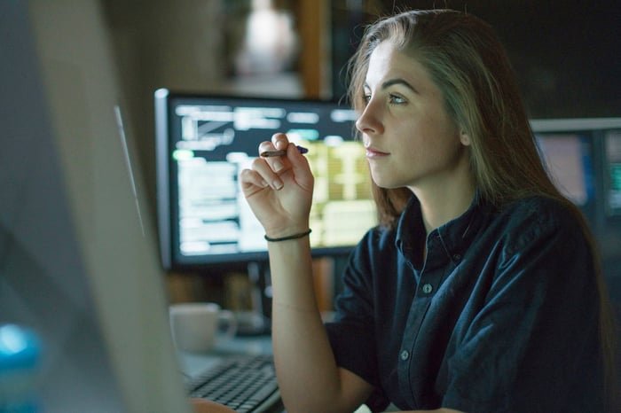 A person looking at a computer screen.