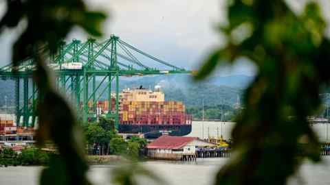 A cargo ship waits at Balboa port before crossing the Panama Canal in Panama City