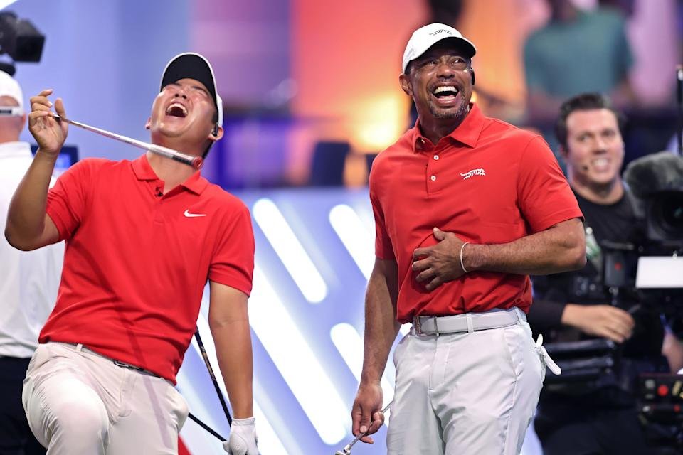 PALM BEACH GARDENS, FLORIDA - MARCH 04: Tiger Woods and Tom Kim of Jupiter Links Golf Club laugh on the ninth hole during their TGL presented by SoFi match against the Atlanta Drive GC at SoFi Center on March 04, 2025 in Palm Beach Gardens, Florida. (Photo by Megan Briggs/TGL/TGL via Getty Images)