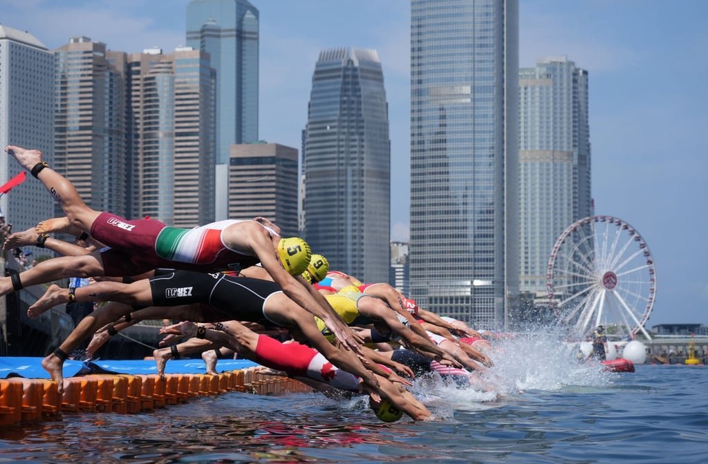 Elson Li picked up an award in the sports section of the Best Photograph category for this image of triathletes diving into the water during the Triathlon World Cup last year. Photo: Elson Li