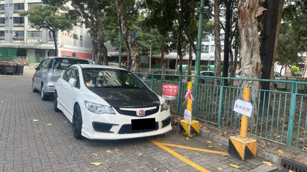 Hong Kong’s ombudsman calls for tougher action against illegal parking in estates