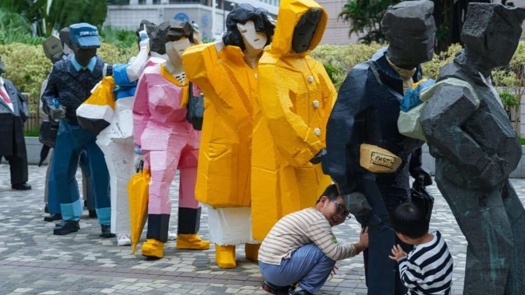 Hong Kong sculpture with yellow raincoats won’t return outside Cultural Centre