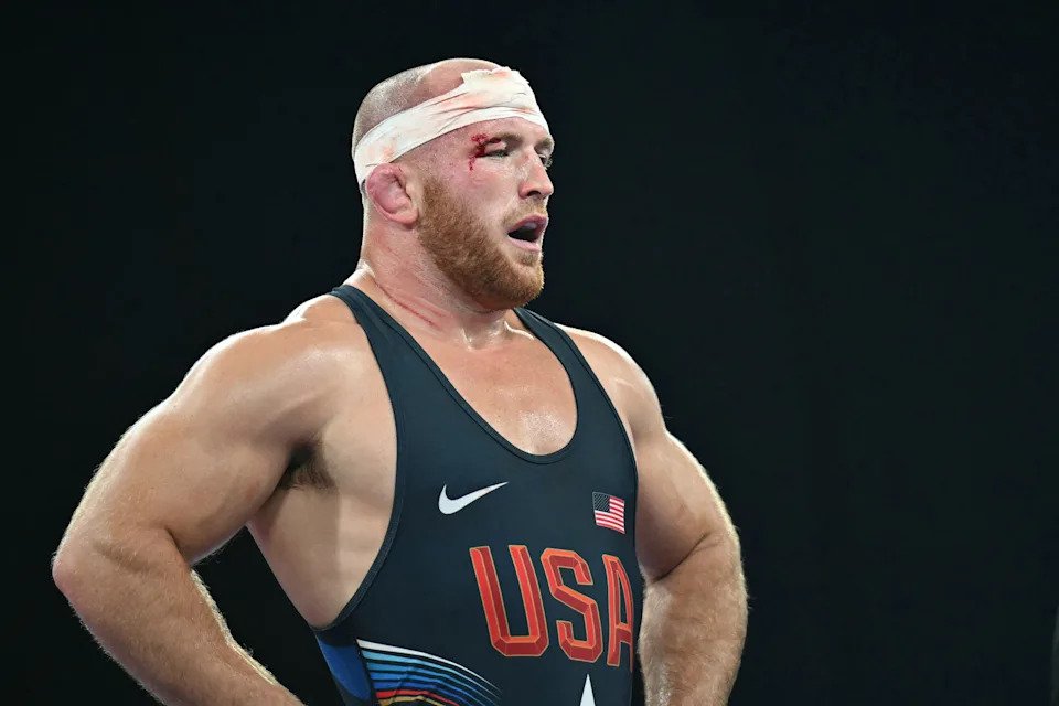 US' Kyle Frederick Snyder reacts to his defeat to Iran's Amirali Azarpira in their men's freestyle 97kg wrestling bronze medal match at the Champ-de-Mars Arena during the Paris 2024 Olympic Games, in Paris on August 11, 2024. (Photo by Punit PARANJPE / AFP) (Photo by PUNIT PARANJPE/AFP via Getty Images)