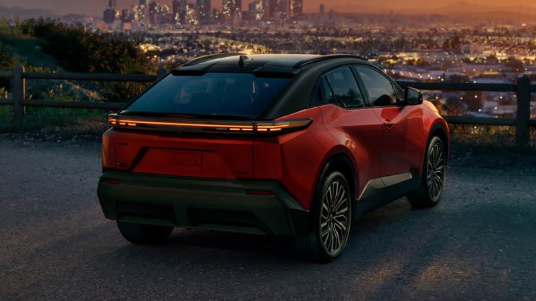 Rear 3/4 view of a red 2026 Toyota C-HR