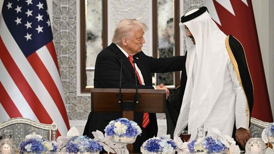 Qatar's Emir Sheikh Tamim bin Hamad al-Thani shakes the hand of the US President Donald Trump (L) at the start of a state dinner at the Lusail Palace in Doha on May 14, 2025.(AFP)