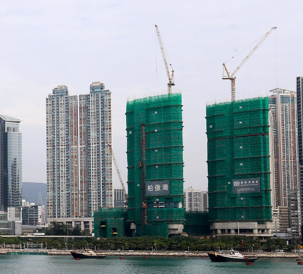 The Deep Water Pavilia luxury residential project, wrapped in green mesh, is being built by a consortium led by New World Development. Photo: Dickson Lee