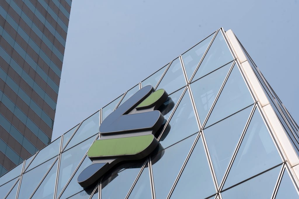 Standard Chartered Bank’s logo atop one of its wealth-management centres in Central. Photo: Nathan Tsui