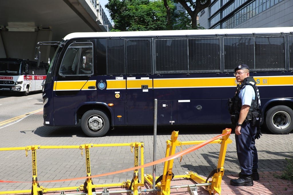 Police are on guard outside the court building. Photo: Edmond So