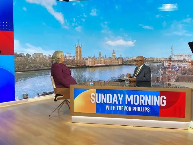 Heidi Alexander seated opposite Trevor Phillips in a TV studio