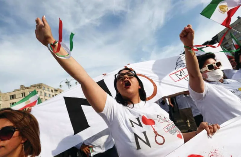 MEMBERS OF the Iranian diaspora in Europe take part in a rally in Brussels last September, marking the first anniversary of the death of Mahsa Amini. (credit: YVES HERMAN/REUTERS)
