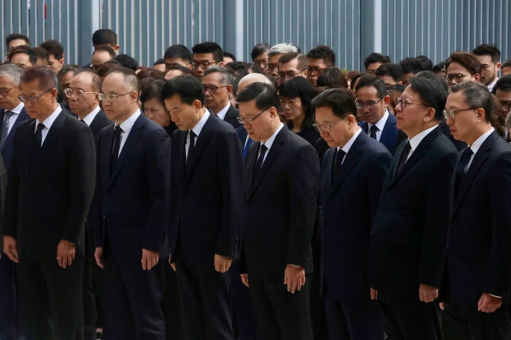 Officials observe three minutes of silence. Photo: Jonathan Wong