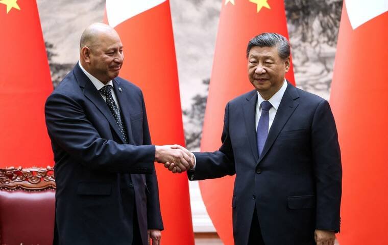 REUTERS/MAXIM SHEMETOV/POOL
                                Tongas King Tupou VI and Chinas President Xi Jinping shake hands after the signing ceremony at the Great Hall of the People in Beijing, China, today.