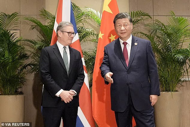 Sir Keir Starmer is expected to travel to Beijing in January. He is pictured with President Xi Jinping at the G20 summit in November 2024