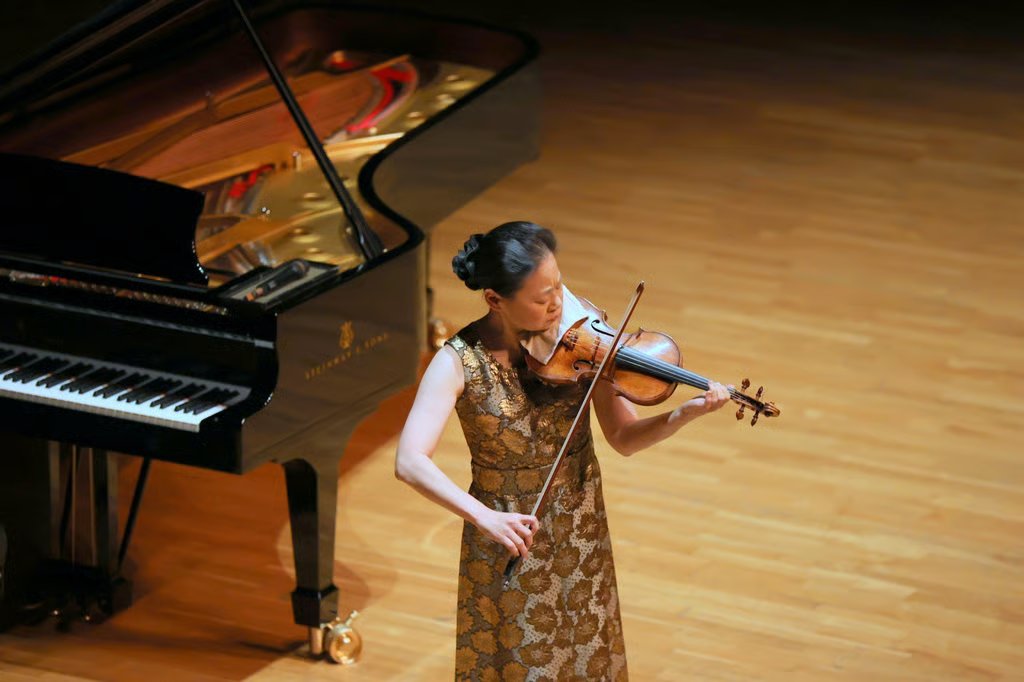 Midori plays the violin unaccompanied as a tribute to the victims of the Tai Po fire during the November 27 concert. Photo: HK Sinfonietta