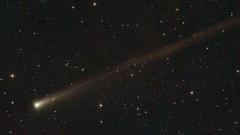 The C/2025 K1 ATLAS comet flying across the night sky past other stars