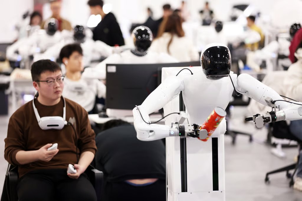Technicians train humanoid robots at a data collection centre run by the robotics company Agibot in Shanghai. Photo: Getty Images