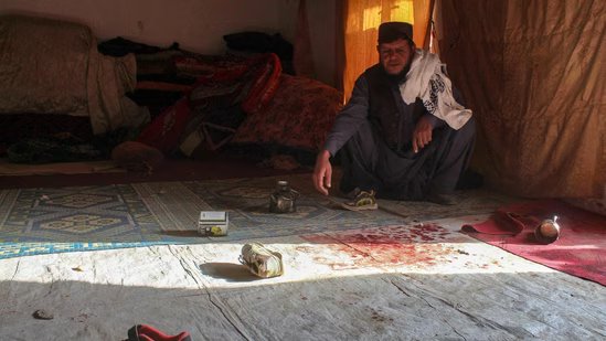 A man sits next to the blood-stained floor inside his damaged house in Chaman on December 6, 2025, following overnight cross-border fire between Pakistan and Afghanistan.(AFP)
