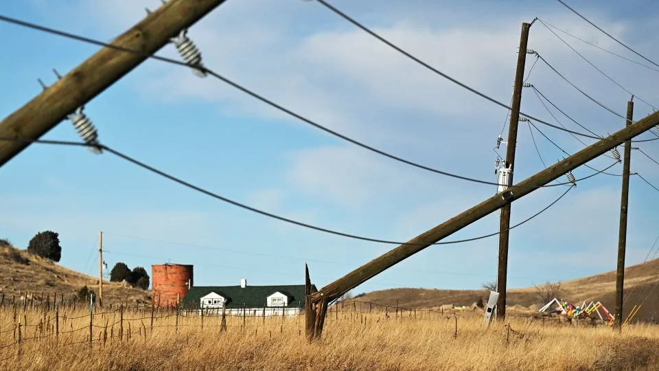 Power poles along U.S. Highway 93 near Golden, Colorado, are snapped in half during a strong windstorm on Wednesday.  Outages are lingering in Colorado as a new windstorm hits. - RJ Sangosti/MediaNews Group/The Denver Post/Getty Images