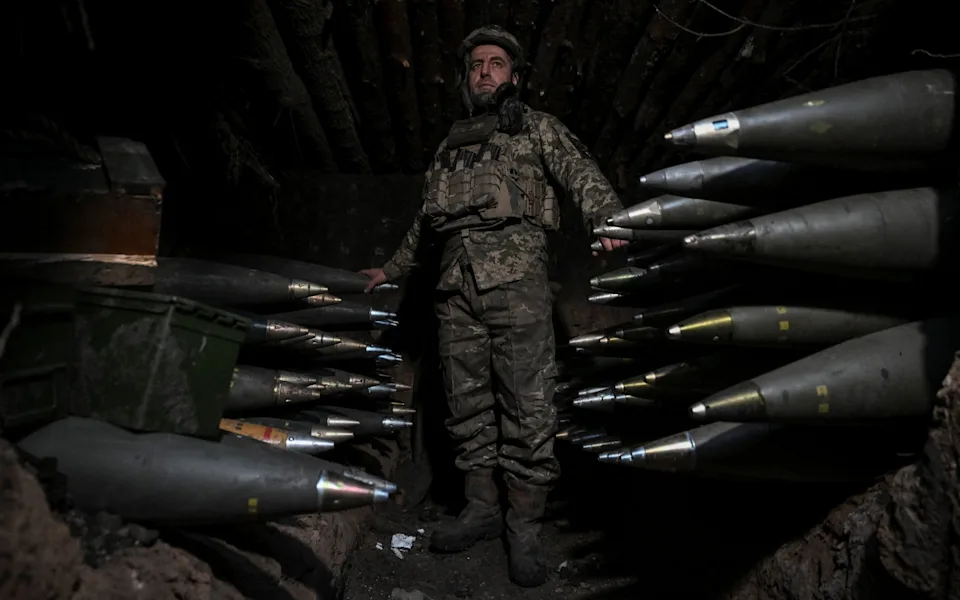 A Ukrainian serviceman prepares shells to fire a M777 Howitzer towards Russian troops in the Dnipropetrovsk region