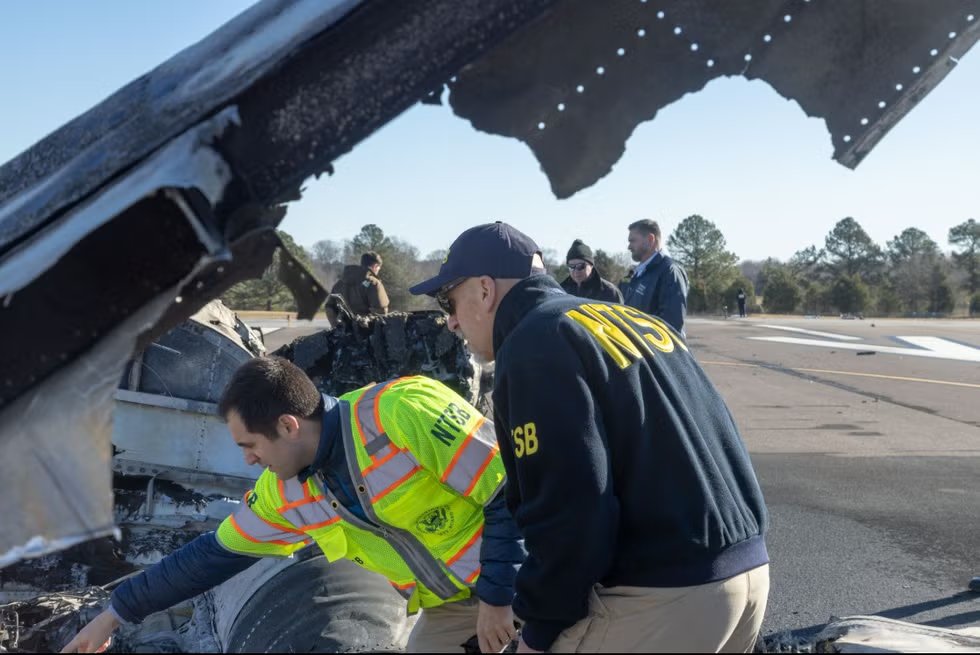 investigation scene at a crash site involving aviation safety officials