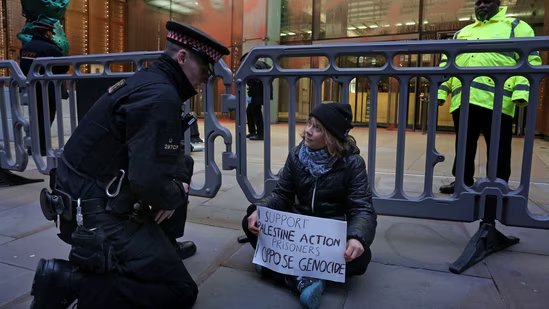 A handout photograph taken on and released by Prisoners for Palestine in London on December 23, 2025 shows Swedish activist Greta Thunberg before her arrest by police outside the offices of Aspen Insurance at Plantation Place on Fenchurch Street on Tuesday. (AFP)
