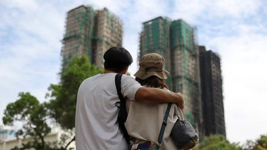 People look on near the Wang Fuk Court housing complex following the deadly fire on Wednesday, in Tai Po, Hong Kong, China December 1, 2025. REUTERS/Amr Alfiky(REUTERS)