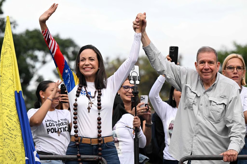 Venezuelan opposition presidential candidate Edmundo Gonzalez Urrutia and opposition leader Maria Corina Machado during their campaign closing rally in Caracas in July. Photo: AFP