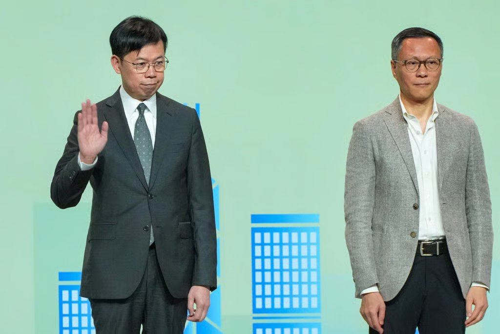Ronick Chan (left) beat Ip Tsz-kin in the Legco election for the finance constituency; the result was announced at the Hong Kong Convention and Exhibition Centre in Wan Chai on December 8. Photo: Karma Lo