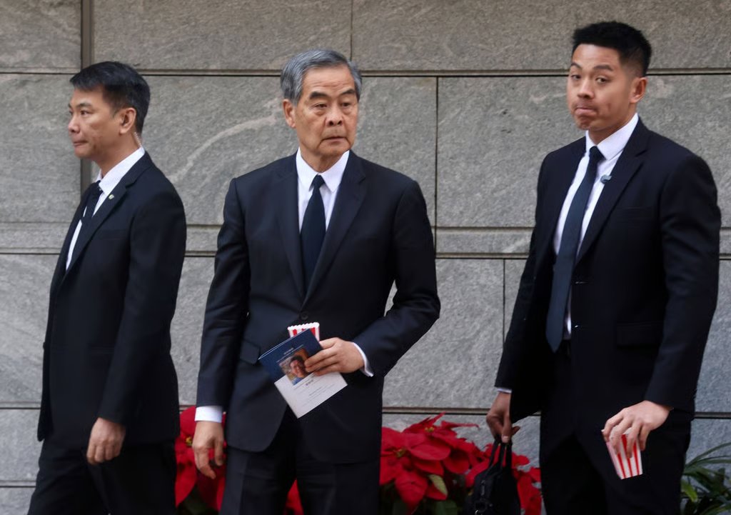 Former city leader Leung Chun-ying (centre) at the memorial service for So. Photo: Jonathan Wong