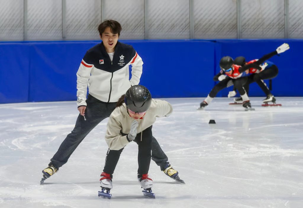 Sidney Chu teaching speed skating to children at DB Ice Rink. Photo: Jonathan Wong