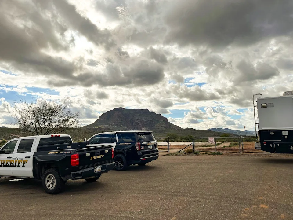 Pinal County Sheriff’s Office vehicles near Telegraph Canyon, south of Superior, where authorities responded to a helicopter crash that killed four people on Jan. 2, 2026.