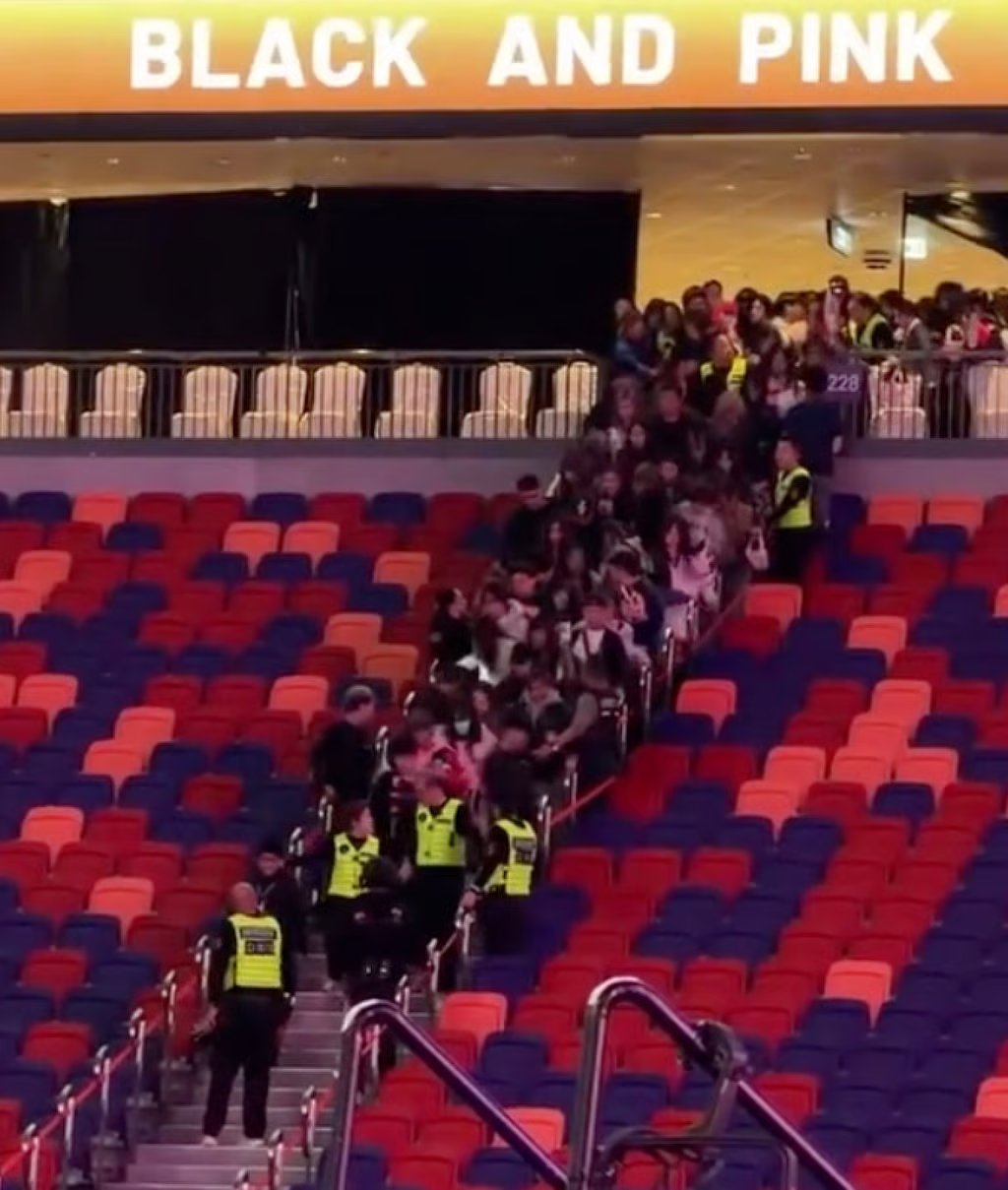 Security guards hold back overeager fans ahead of Blackpink’s show on Saturday. Photo: Handout