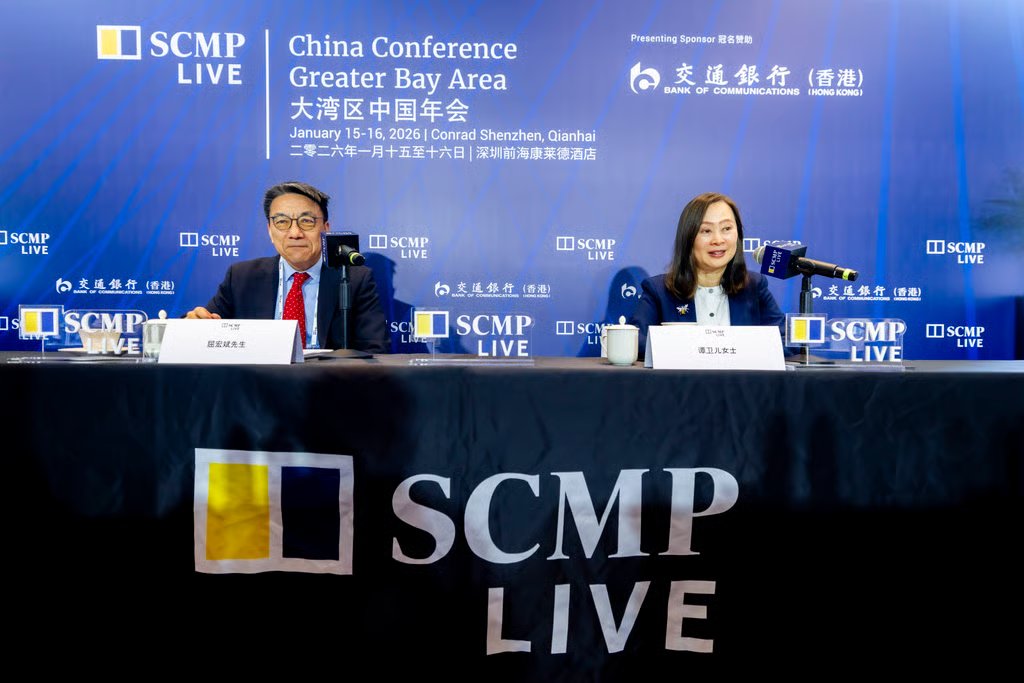 More than 300,000 Hong Kong residents are expected to seek medical care in Shenzhen this year, says Qu Hongbin, chief economic adviser to the Shenzhen Qianhai Authority, who is seen with Tammy Tam, publisher of the Post. Photo: SCMP