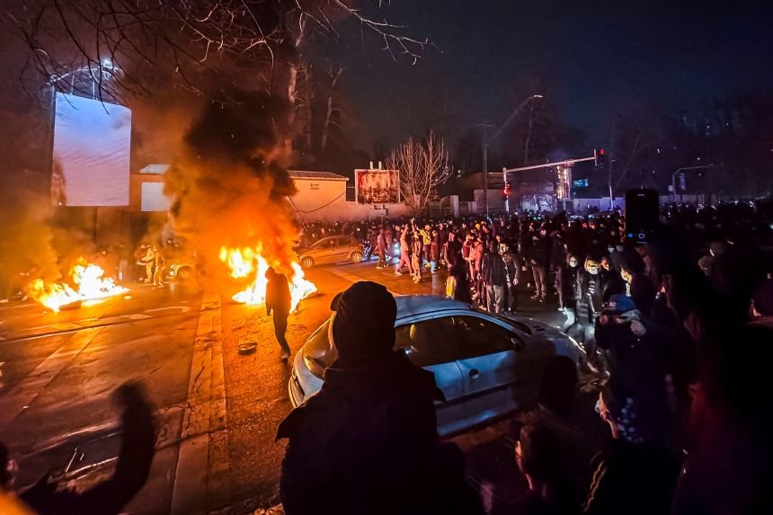 Iranians gather while blocking a street during a protest in Tehran, Iran on January 9, 2026.