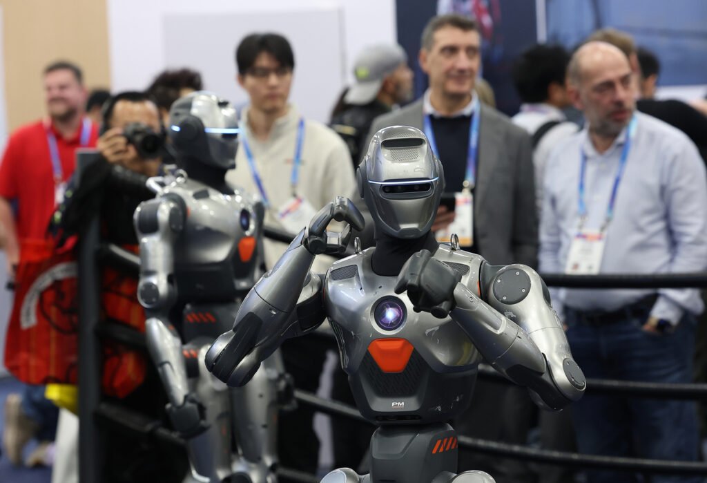 Humanoid robots made by China's EngineAI showcase their boxing capabilities during the Consumer Electronics Show held in Las Vegas on Jan. 7, 2026. [YONHAP]