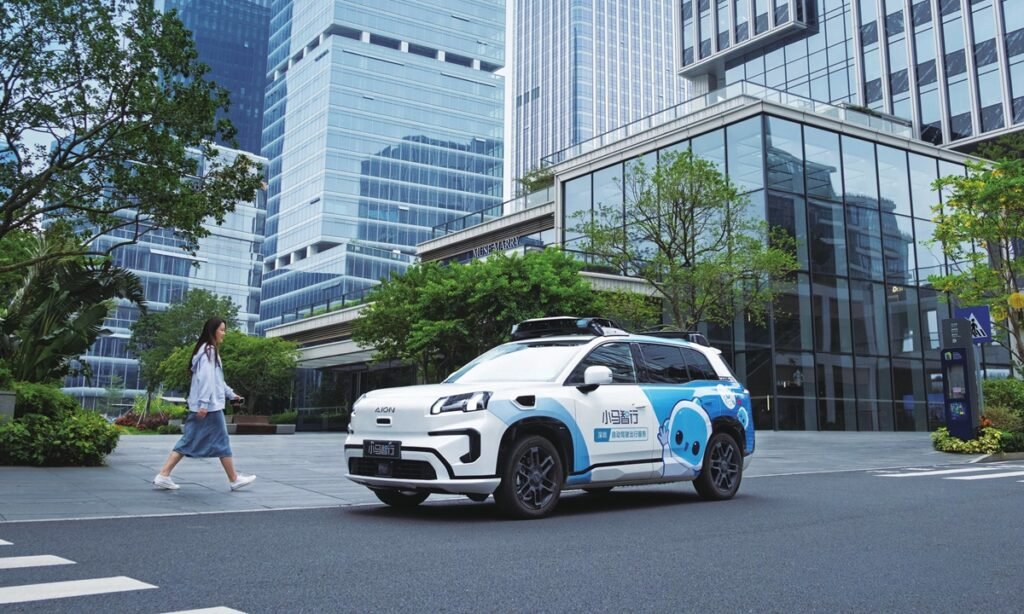A passenger walks to a Pony.ai robotaxi in Shenzhen, South China's Guangdong Province, during the 2026 Spring Festival holiday. Photo: Courtesy of Pony.ai
