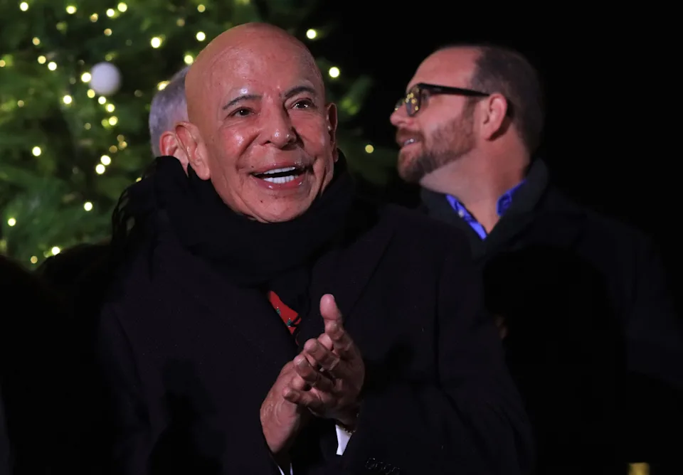 Fred Loya Sr. applauds during the opening ceremony and Christmas tree lighting sponsored by his company at the Holiday Lights Spectacular at Ascarate Park on Nov. 25, 2022.