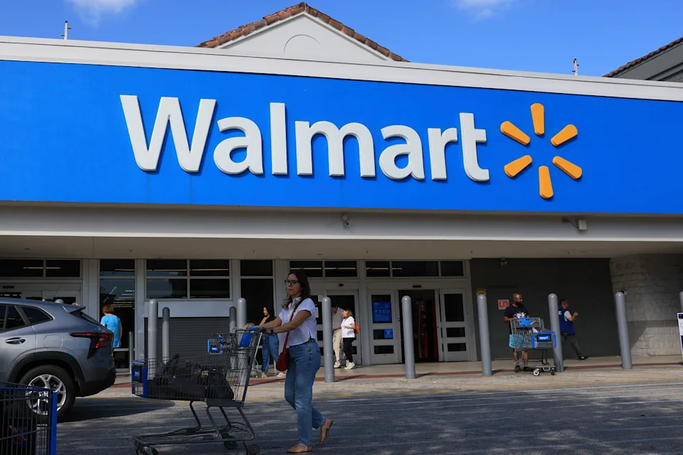 HOLLYWOOD, FLORIDA - NOVEMBER 20: A Walmart sign hangs on the exterior of the store on November 20, 2025 in Hollywood, Florida. The retailer reported earnings per share of 62 cents and revenues of $179.5 billion through its latest quarter, sending the stock up more than 5.6% to above $106 shortly after trading opened. (Photo by Joe Raedle/Getty Images)